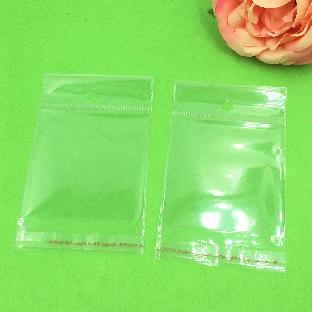 1000 pcs 12x6.5 cm Batal Transparan OPP Tas dengan Menggantung lubang Packing Plastik Tas Self Adhesive Seal tahan air OPP Tas