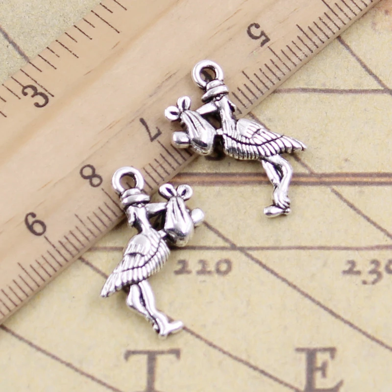 20 sztuk Charms bocian dziecko ptak 23x18mm tybetański brąz srebrny kolor wisiorki antyczny tworzenia biżuterii DIY Handmade Craft