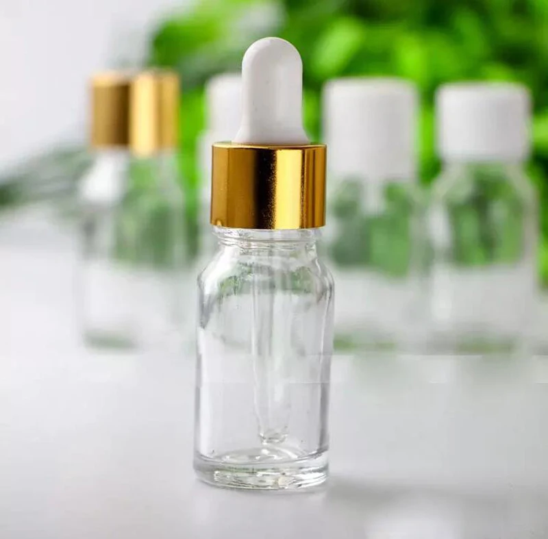 

Fast Shipping Clear Empty Glass Bottles Aromatherapy Essential Oil Refillable Bottles 10ml Dropper Bottle With Gold Lids