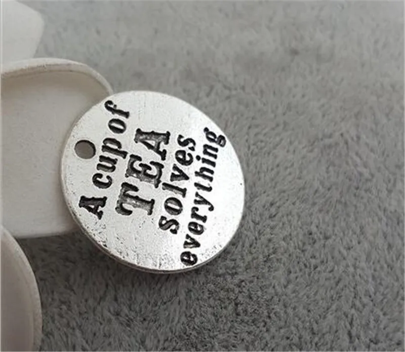 10 Pieces/Lot 25mm words a cup of tea solves everthing round disc charm tea charms pendant