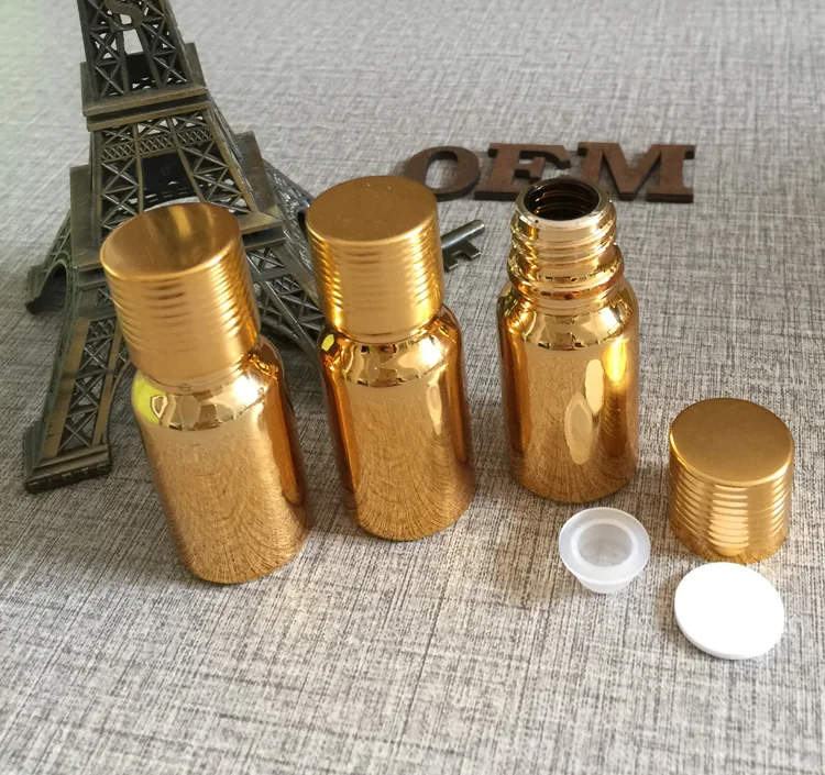 

high-grade 100pcs gold glass 10ml essential oils bottles with cap wholesale,buy 10 ml samll essential oil glass bottle suppliers