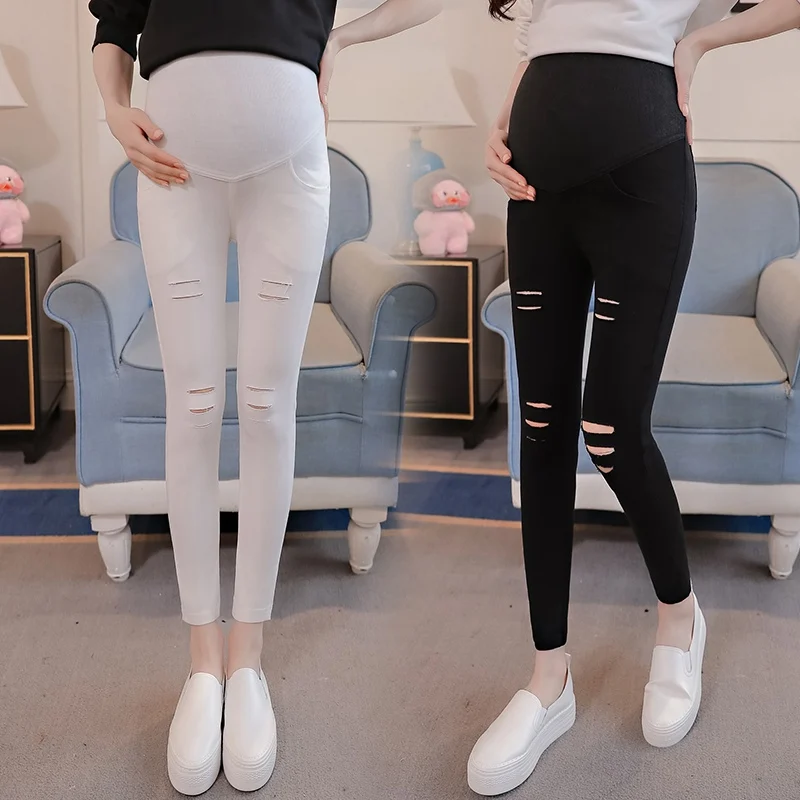 

Spring pregnant women nine pants pregnant women stomach lift pants feet pants hole casual maternity pregnancy library