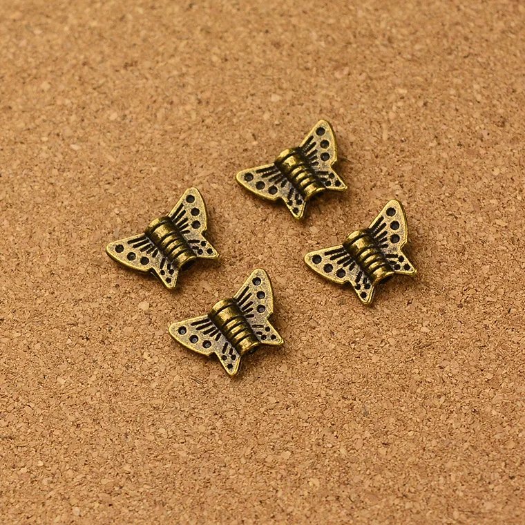 

Wholesale vintage 200pcs antique bronze Butterfly small hole bead charm diy jewelry Findings 1.5mm hola dia