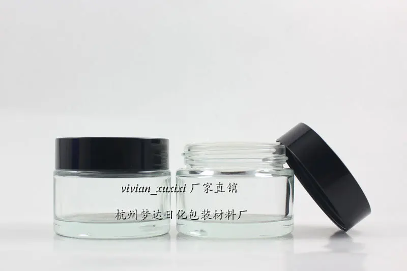 

30pcs 50g clear glass cream jar with black plastic lid, 50g cosmetic packaging for mask or eye cream, empty 50g glass bottle