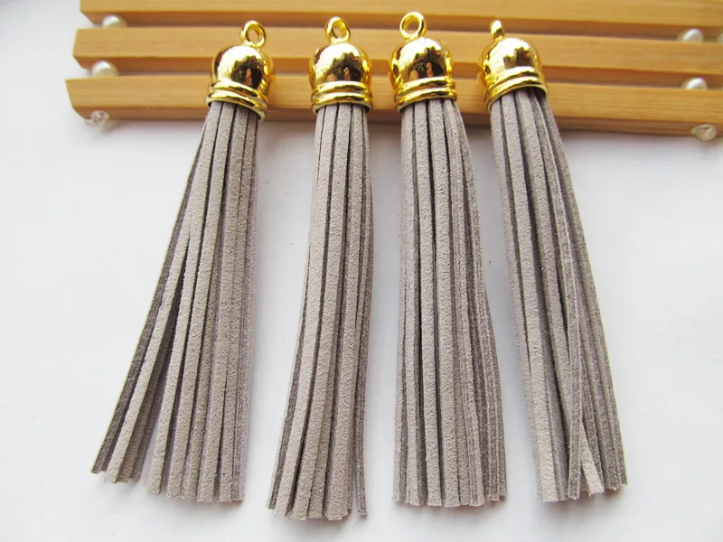 

Free Shipping 100Pcs 90mm Light Grey Suede Leather Jewelry Tassel For Key Chains/ Cellphone Charms Top Plated End Caps Cord Tip