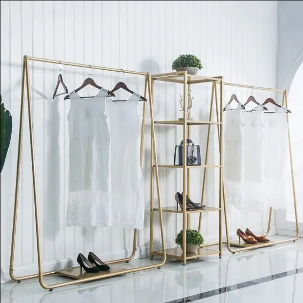 

Clothing store display rack floor - to - floor combination of gold clothing store shelves iron art island display rack