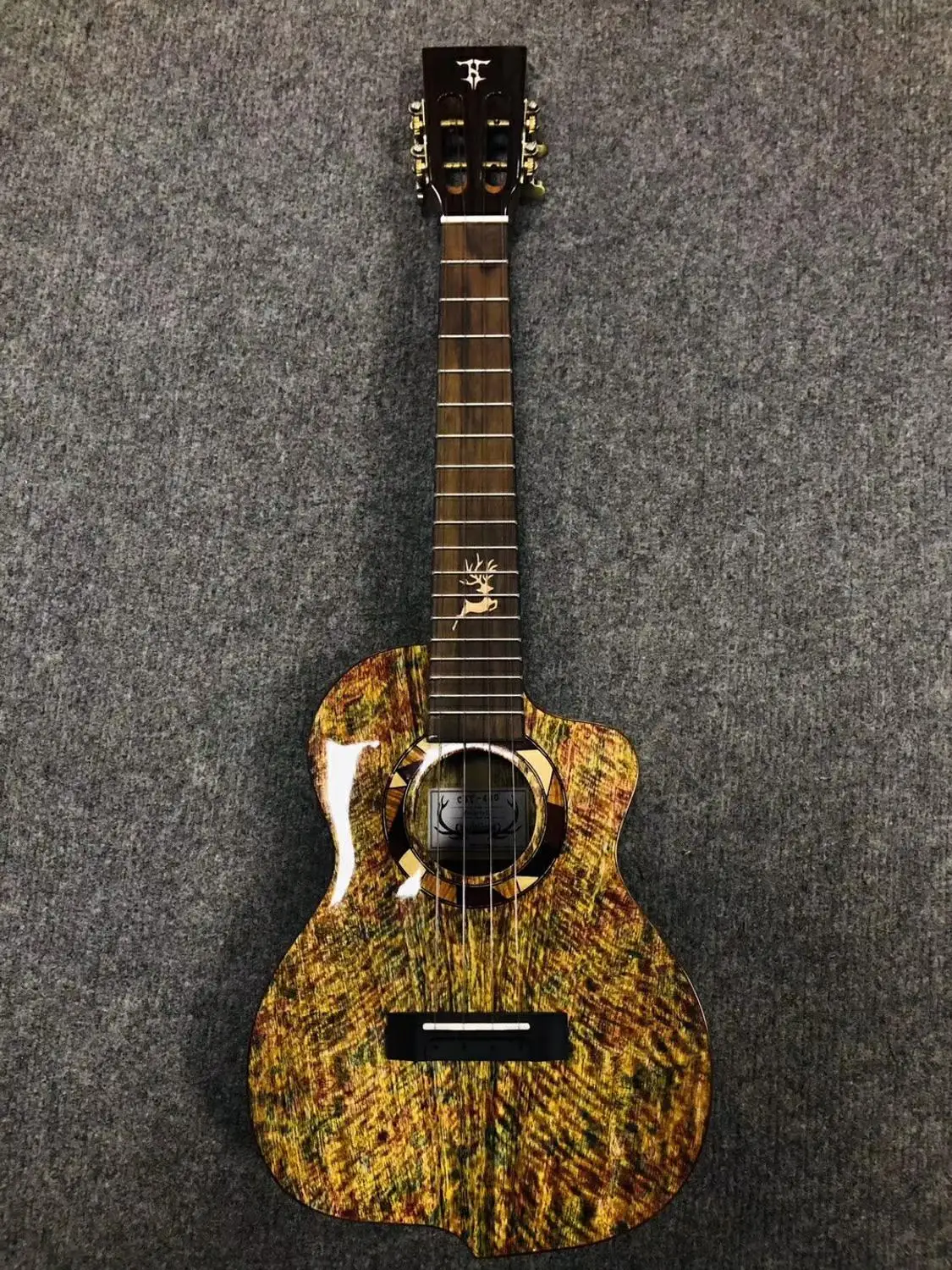 

26-inch new mango wood ukulele Hawaiian four-string guitar instrument, pizza color, upper and lower corners.