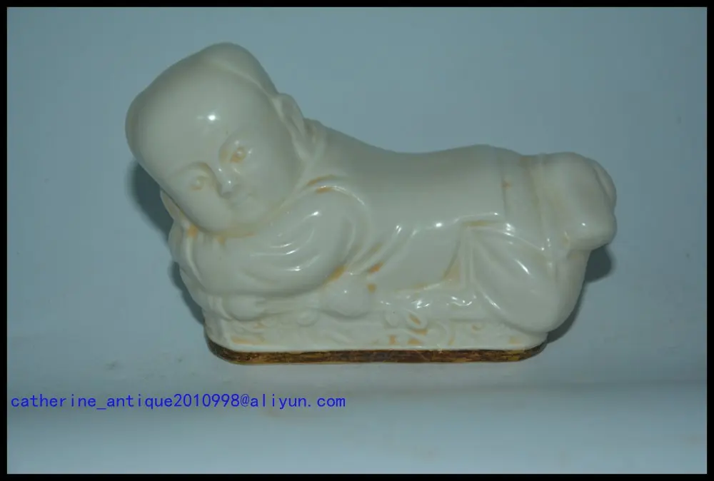 

Rare Tang Dynasty(618--907)Ding kiln porcelain pillow,cover with gold leaf,white glaze,Child Statue,Free shipping