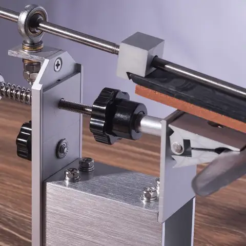 Rotary knife sharpener system