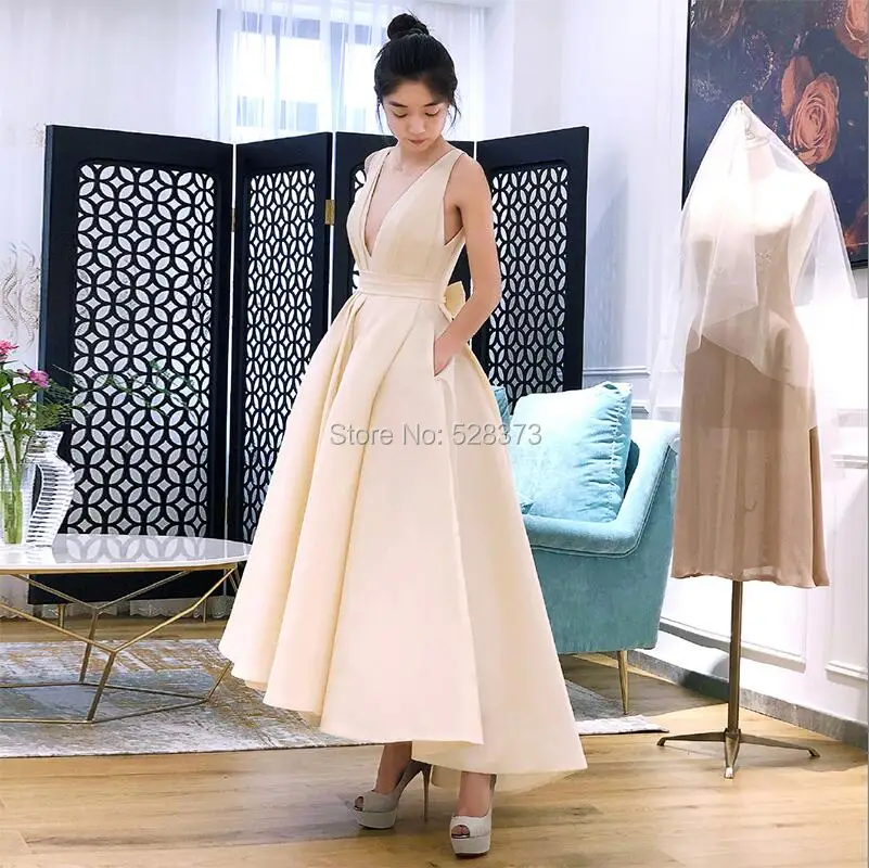 Chic Off - White Sleeveless Gown Deep V - neck high waist front - short - back - long Ideal for special events exudes elegaance