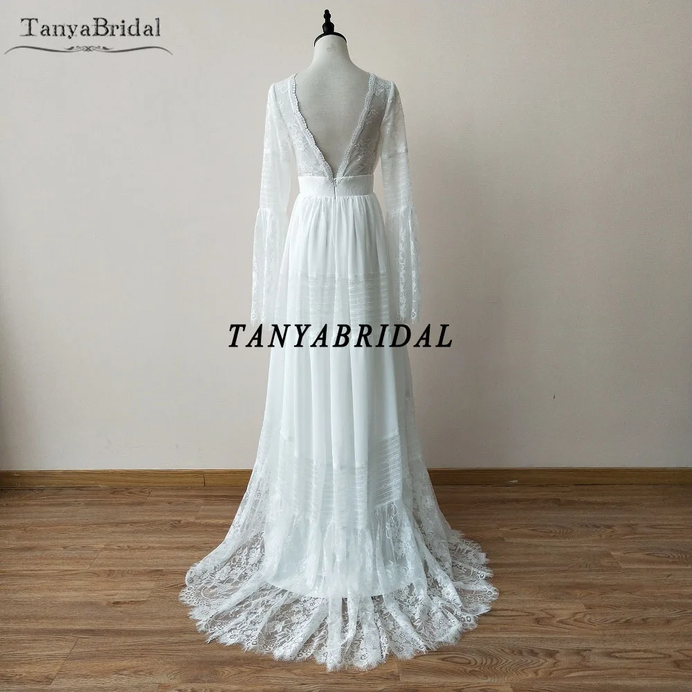 정교한 보헤미안 웨딩 드레스 긴 소매 레이스 비치 신부 가운 플레어 슬리브 백리스 베스 티드 드 Noiva 세련된 DW047