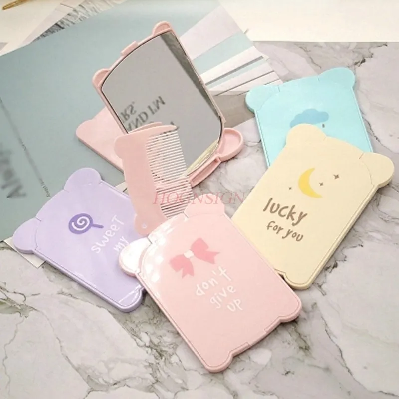 พับด้วยหวีกระจกขนาดเล็กกระจกพกพาแบบพกพามินิโต๊ะเครื่องแป้งภาพประกอบการ์ตูนพลาสติกขาย