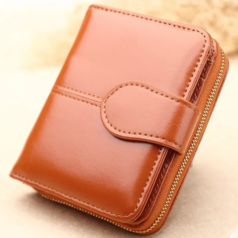 

Clutch female brand Bag wallet women zipper design mobile phone bags japanned PU lOil wax eather folder clutch Short paragraph