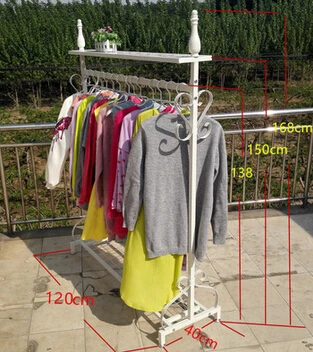 

Wrought iron clothing store display shelf. Console clothes rack. Clothing racks display shelf.