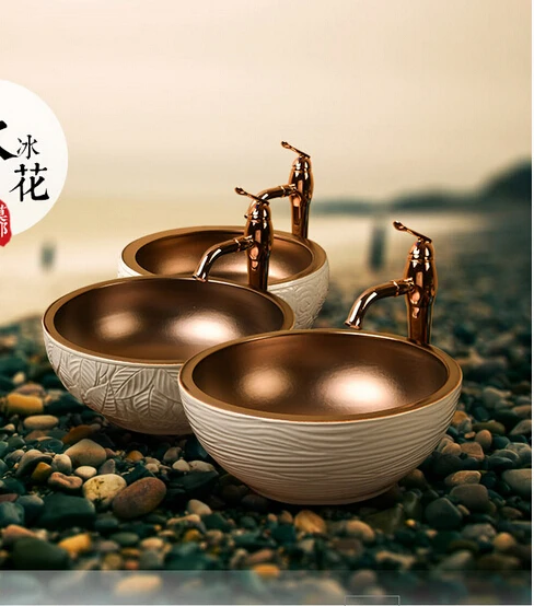 European golden. Handmade ceramic basin. Art stage basin. The sink.