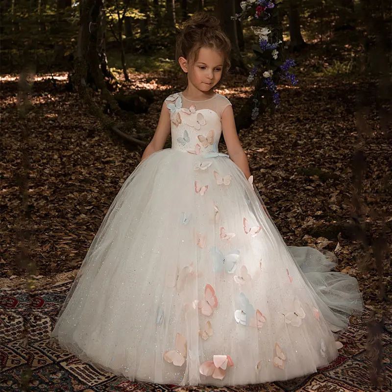 

Fancy Butterfly Decoration Ivory Tulle Flower Girl Dress Sheer Neckline Cap Sleeves Kids Pageant Ball Gowns with Rhinestones