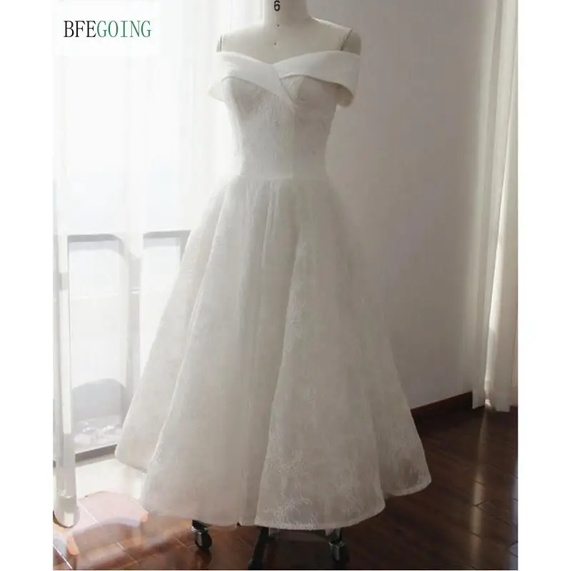 

The Tea Length A-Line Wedding Dress Beaded Lace and Highlighted An Asymmetrically Draped Portrait Neckline Custom Made