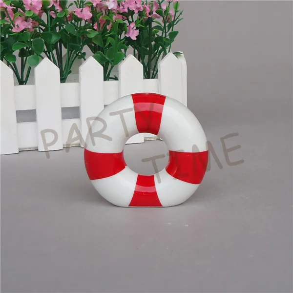 Ceramic round spice shakers, salt shaker and pepper in swim ring pattern