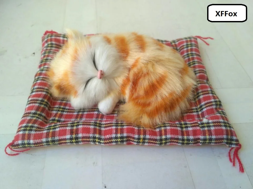 

cute real life sleeping cat model on a mat plastic&furs simulation yellow stripe cat doll gift about 13x10cm xf1226