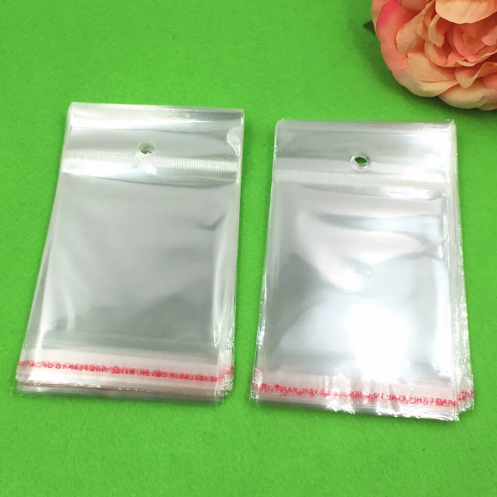 1000 pcs 12x6.5 cm Batal Transparan OPP Tas dengan Menggantung lubang Packing Plastik Tas Self Adhesive Seal tahan air OPP Tas