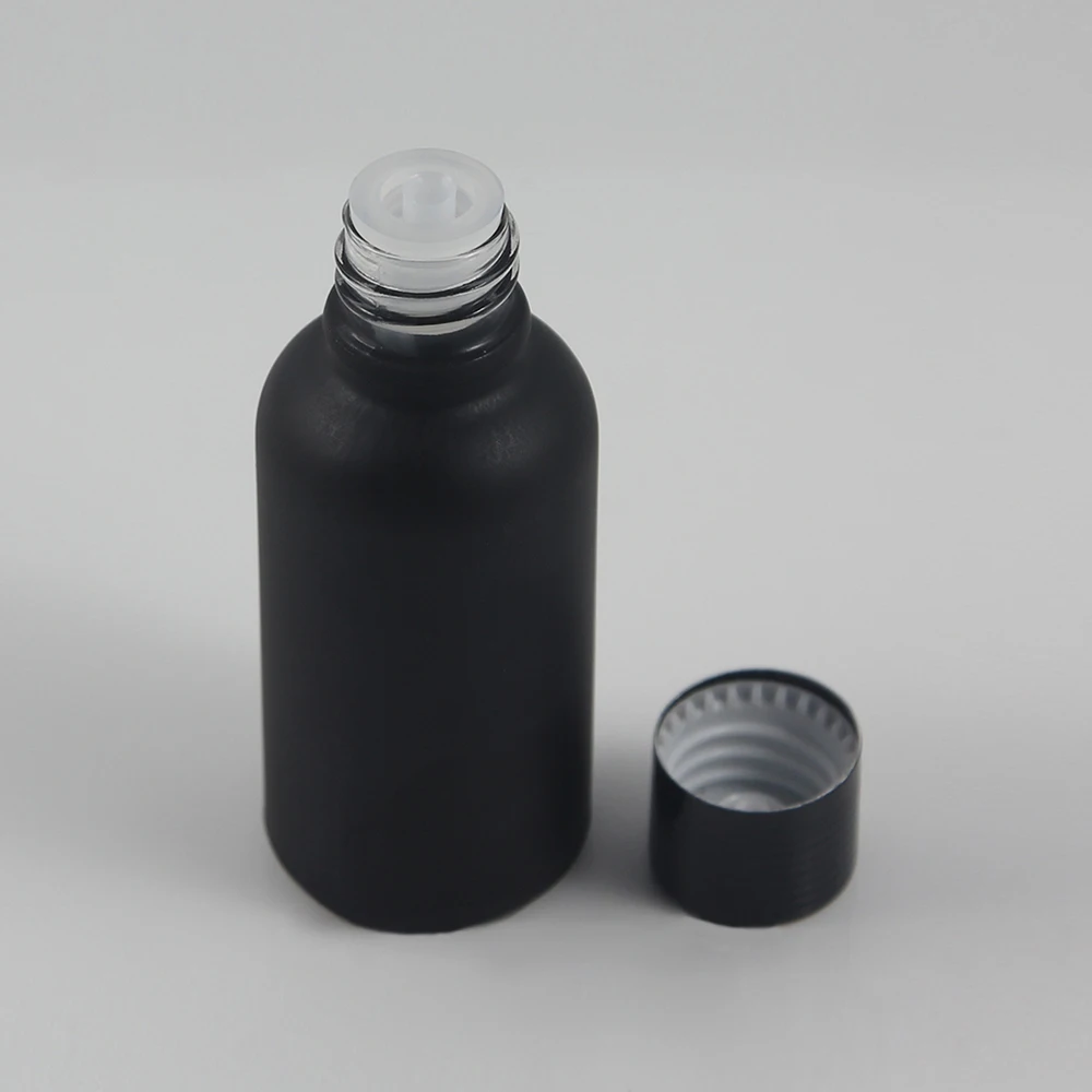 

whoelsale 50pcs 1oz black frosted Essential Oil Glass Bottle With black cap, 30 ml frost glass essential oil bottles for sale