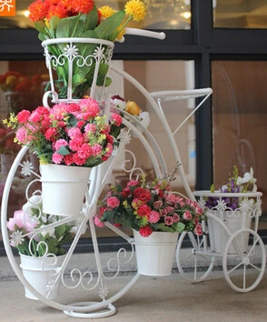 Bicycle florist. Wrought iron layers The balcony floor cosmetic.