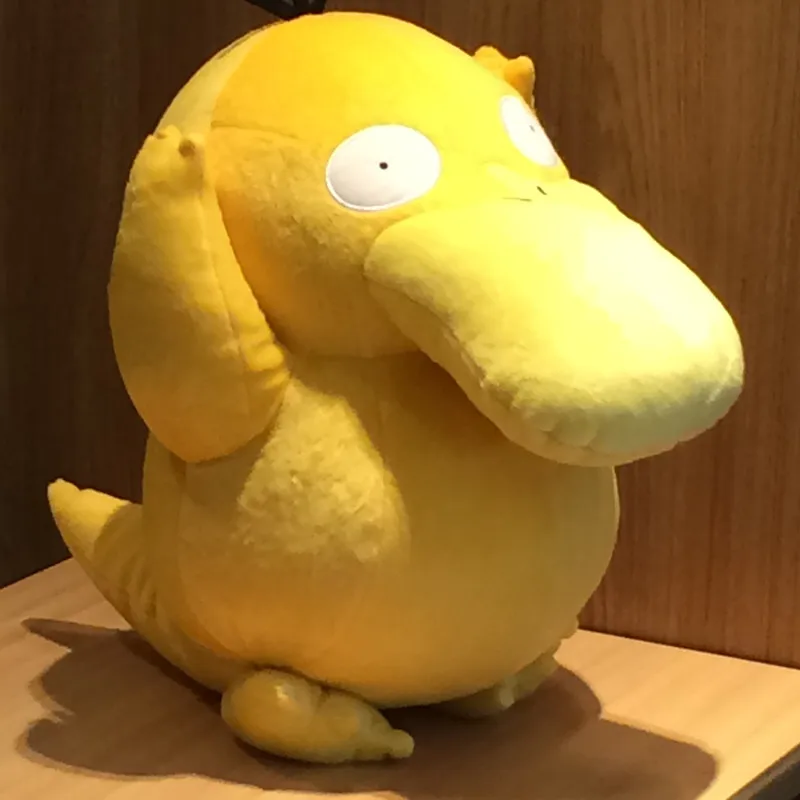 

Anime Games Pokemon series new 38CM Psyduck plush toy Swire armor stuffed toys A birthday present for children.