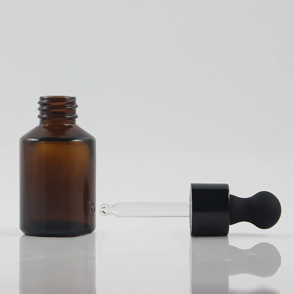 Protected from light amber 30ml glass dropper bottle with gold silver and black cap in stock