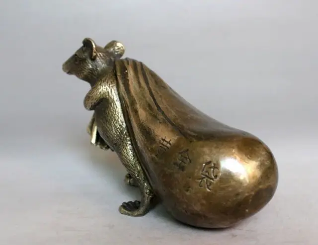 It is worth collecting OLD copper Bronze Mouse holding a bag of gold