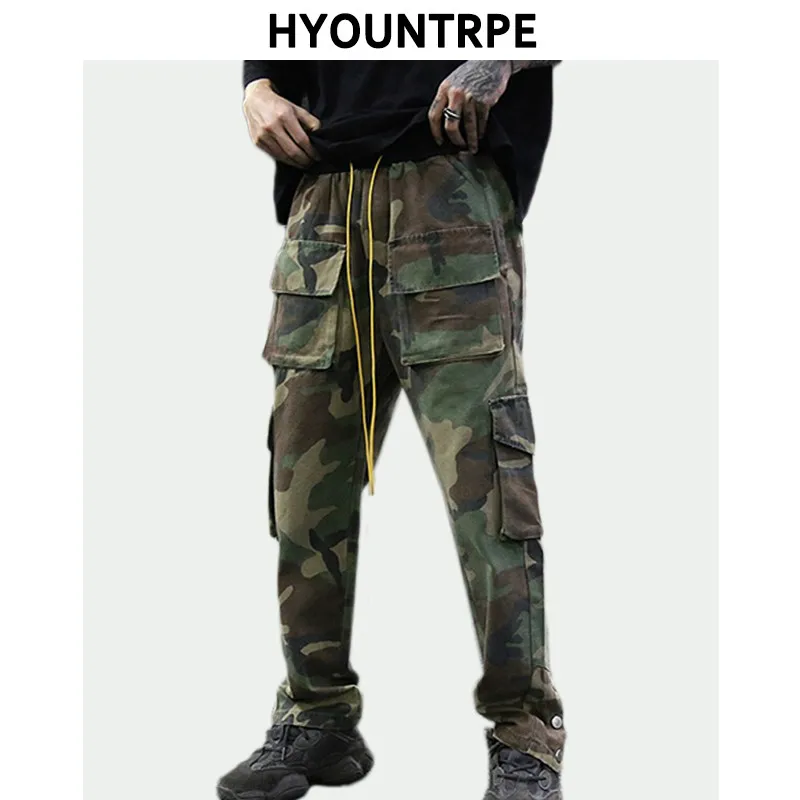 Pantaloni Hip Hop mimetici da uomo tasche con bottoni inferiori pantaloni Cargo moda elastico in vita con coulisse abbigliamento sportivo Streetwear
