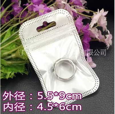 

Retail 5.5*9cm 2.16"x3.54" 300Pcs/Lot White / Clear Self Seal Zipper Plastic Packing Bag Zip Lock Package Bags With Hang Hole