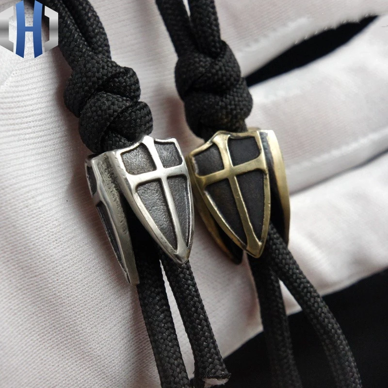 цена EDC Brass Three-sided Shield Paracord Beads Knife Beads Blade Hanging Buckle Phone Pendant EDC Multi Tools Paracord Beads