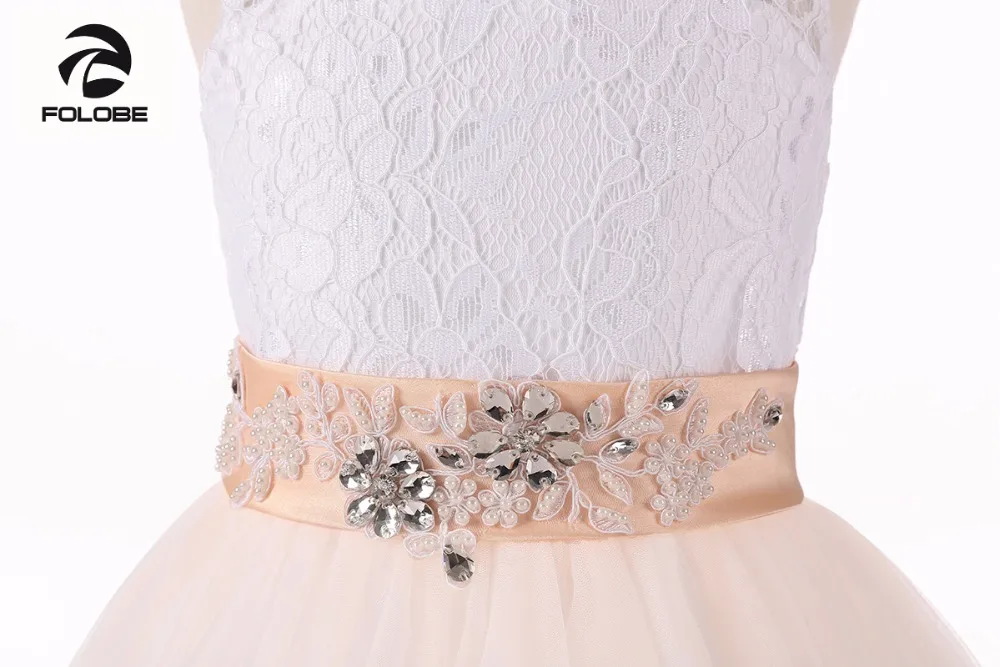 แชมเปญคริสตัลลูกปัดลูกไม้ดอกไม้สำหรับงานแต่งงานโบว์ Sash Girls First Communion Gowns ชุดพิเศษ