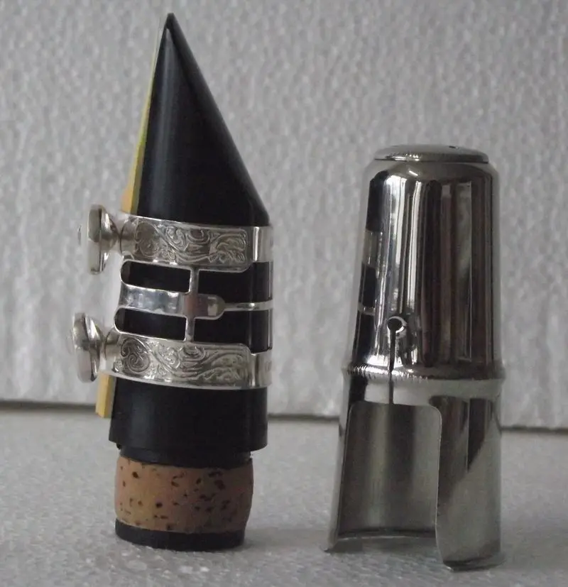 

New Clarinet mouthpiece and carved ligature metal cap