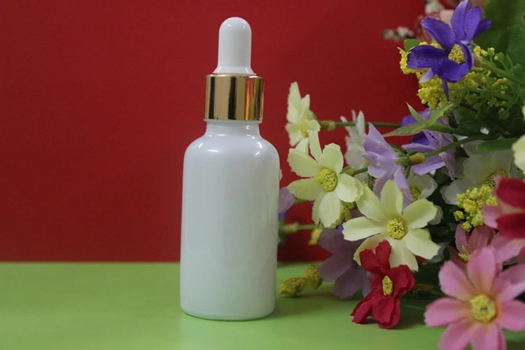 

wholesale 100pcs white color glass 1 ounce dropper bottles with golden cap , 1 oz dropper bottle glass with aluminium gold cap