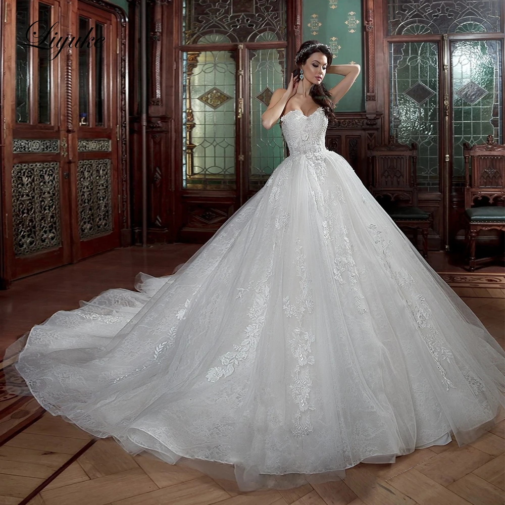 

Liyuke Sexy Strapless Ball Gown Wedding Dress Of Elegant Princess Wedding Gown With Lace Up Closure