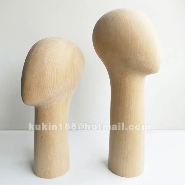 Wooden mannequin head used for hats display