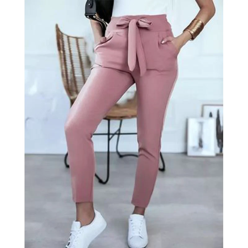 High-waisted solid color pencil pants with bandage design, pockets, and slimming effect for summer streetwear