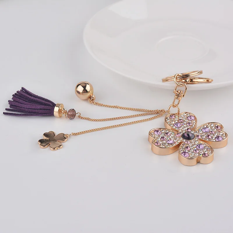 New crystal keychain rhinestone car leather tassel keychain female creative cute flower bag pendant four-leaf clover Keychain