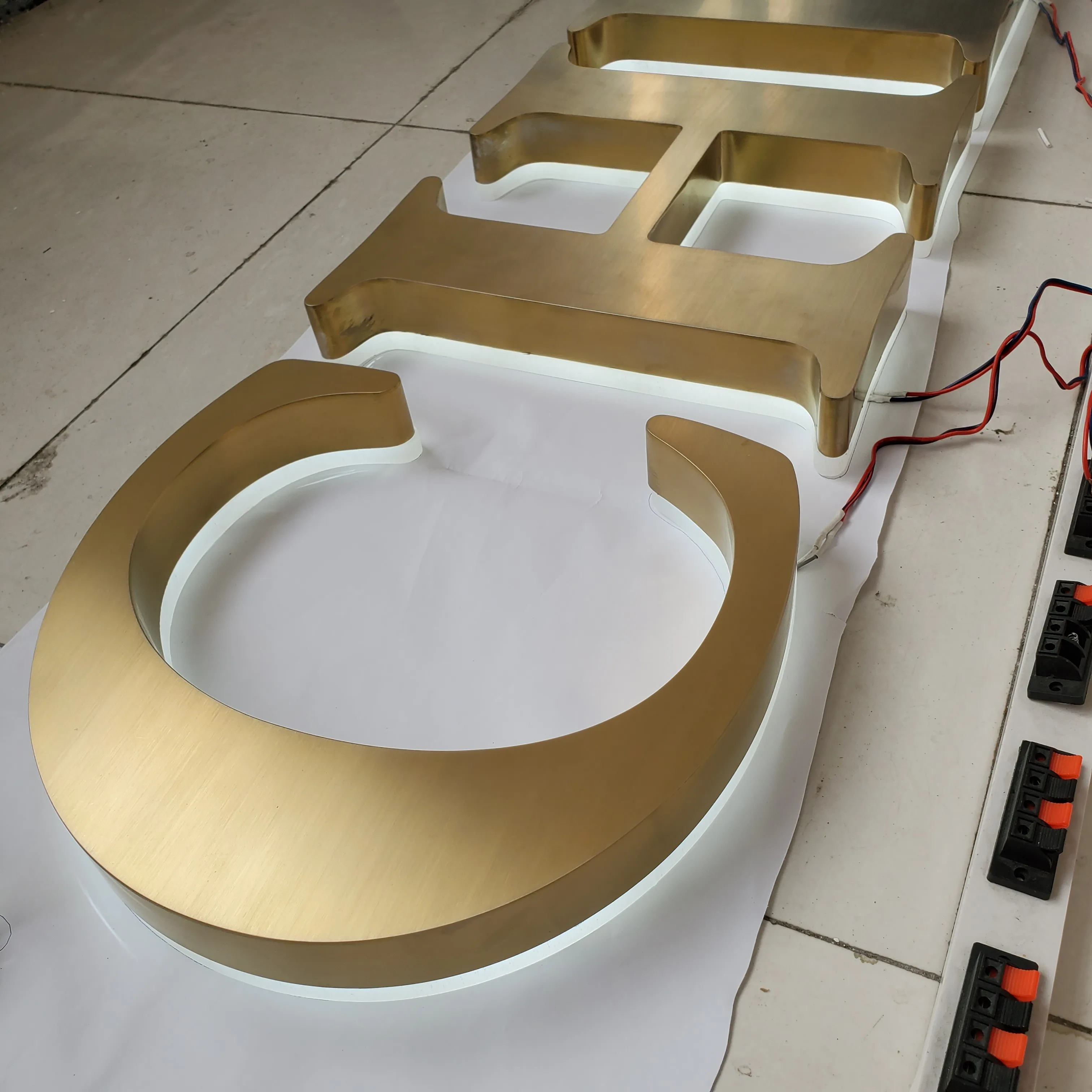 

halo lit stainless steel metal custom led sign