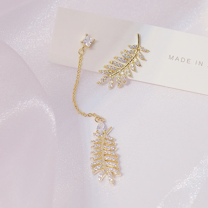 

Ins Hot Sale Exquisite Asymmetry Design Leave Women Earring Elegant Feminia Cubic Zircon Stud Earring Bella Accessories Pendant