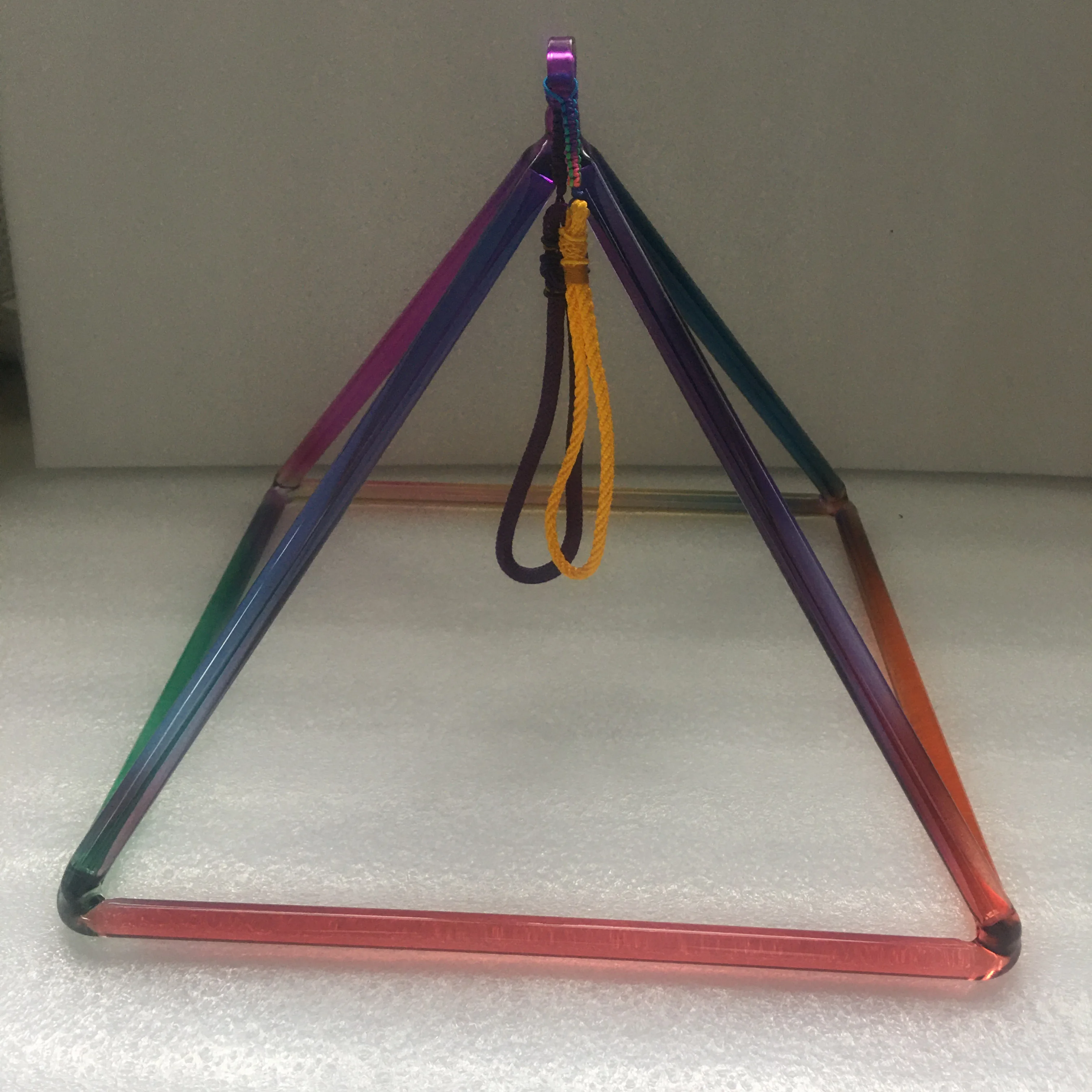 

Crystal singing pyramid 12inch with mixed chakra colors for sound healing.