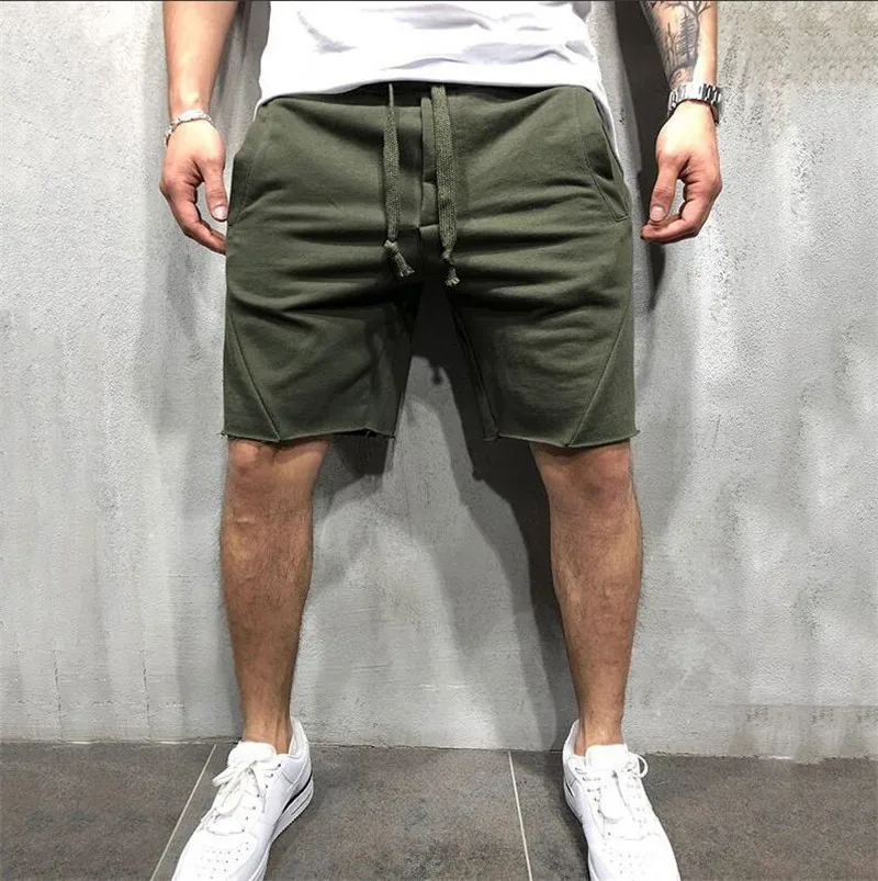 Pantalones cortos de estilo salvaje para hombre, pantalones cortos rasgados de Color sólido, pantalones cortos de entrenamiento para correr