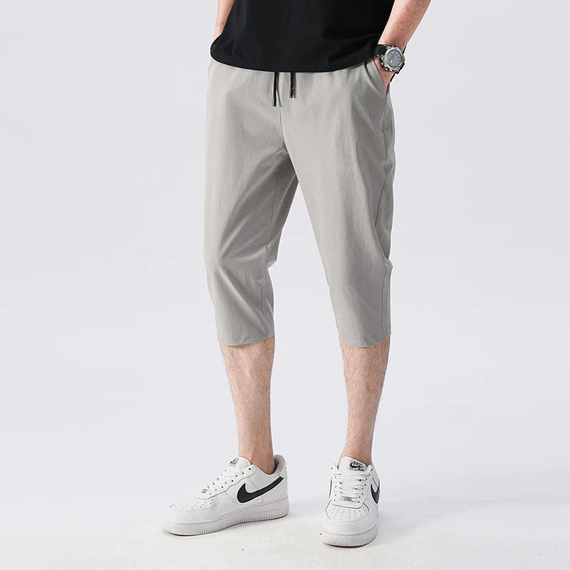 Pantalones deportivos informales para hombre, Shorts elásticos de 7 puntos, ajustados, de seda de hielo, de secado rápido, versión coreana, para