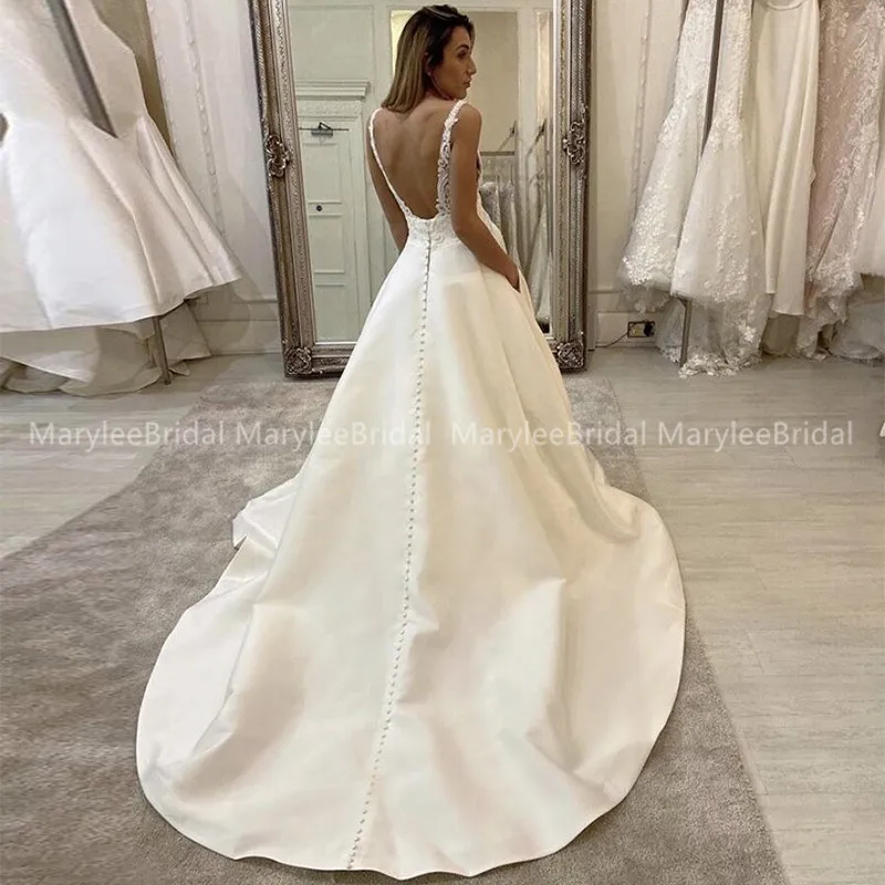 Spaghetti Strap A-lijn Trouwjurken V-hals Satin Geappliceerd Backless Witte Bruidsjurken Met Zakken Robe De Soiree De Mariage