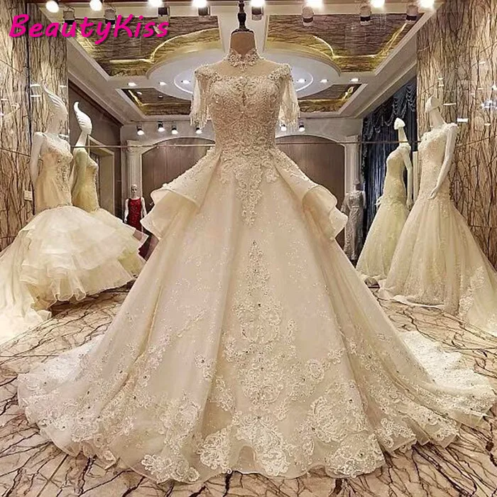 Abiti da sposa arabi di lusso cristalli pizzo collo alto abiti da sposa perline Appliques Royal Train abiti da sposa con fiocco