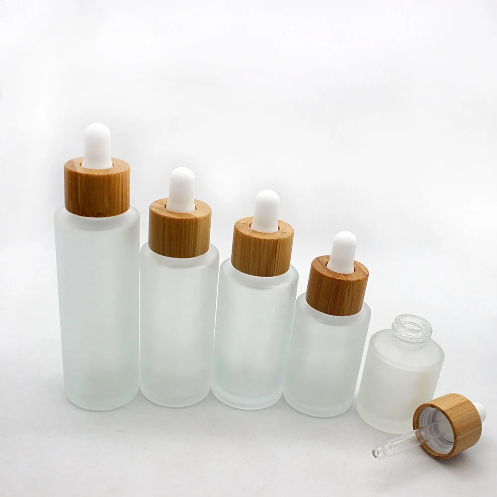 

Custom Logo Wholesale Spray Bottles 100ml 120ml 150ml Transparent Frosted Glass Bottle Bamboo Lid Empty Cosmetic Containers