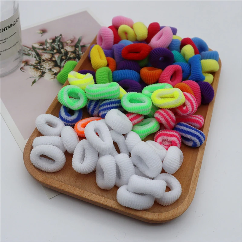 50/100pcs neonate piccole fasce per capelli elastici porta coda di cavallo per bambini fascia per capelli cravatte colorate Mini elastico accessori per capelli