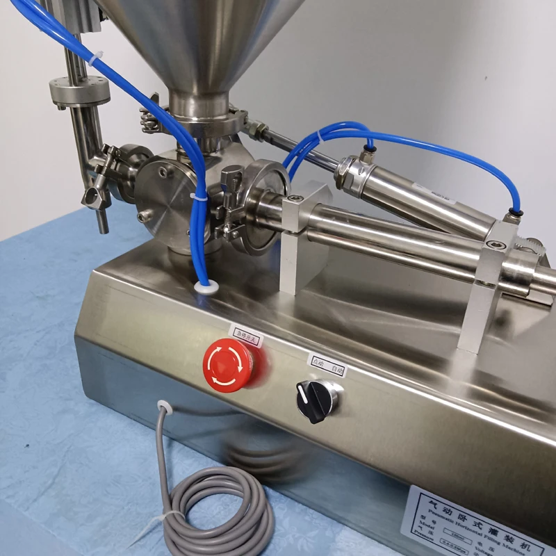 Pequeña máquina neumática de llenado de pasta de un solo cabezal, máquina de llenado eléctrica de productos para el cuidado de la piel, salsa de pasta de propóleo