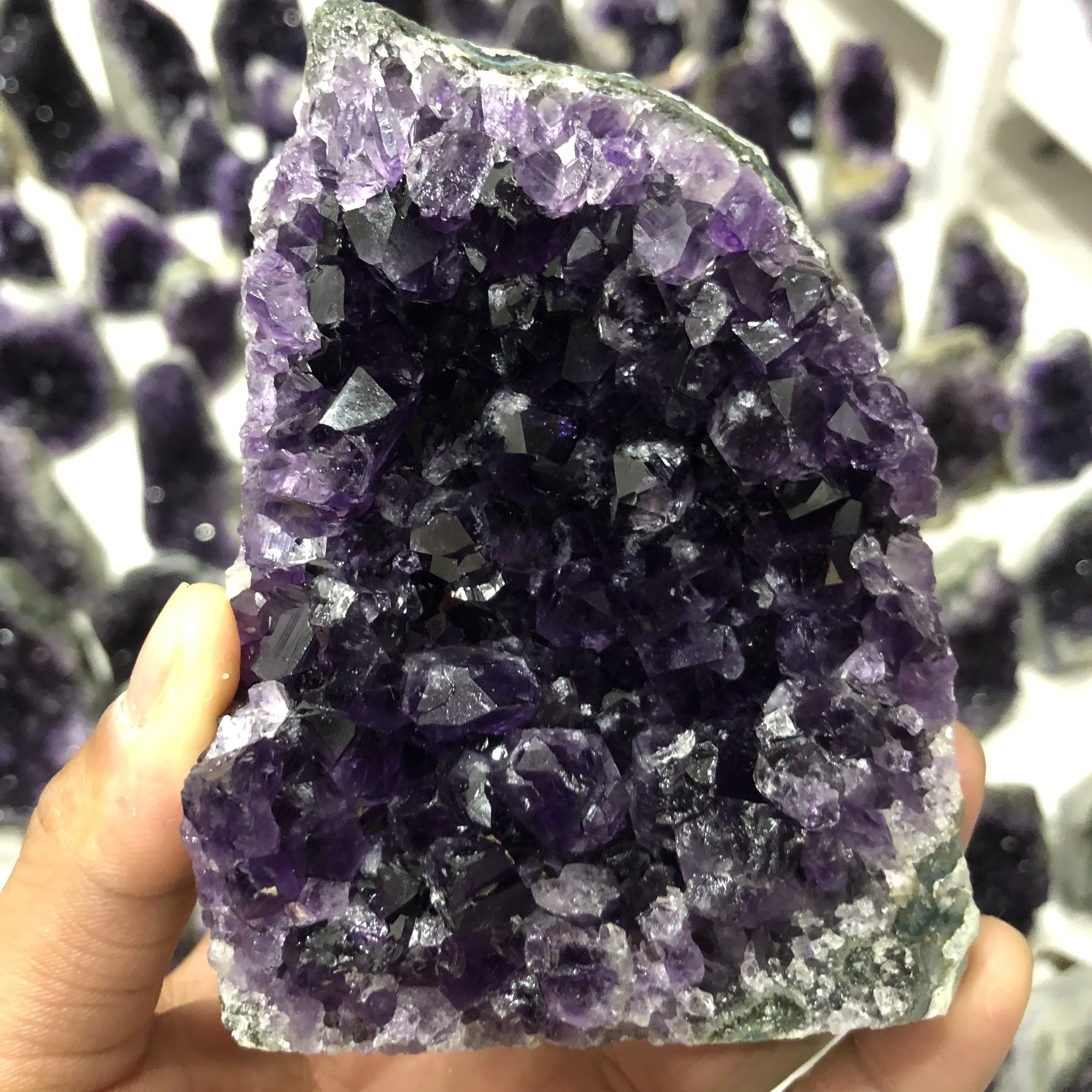 A natural amethyst cluster of Uruguayan specimens, the perfect cargo can purify the air and heal